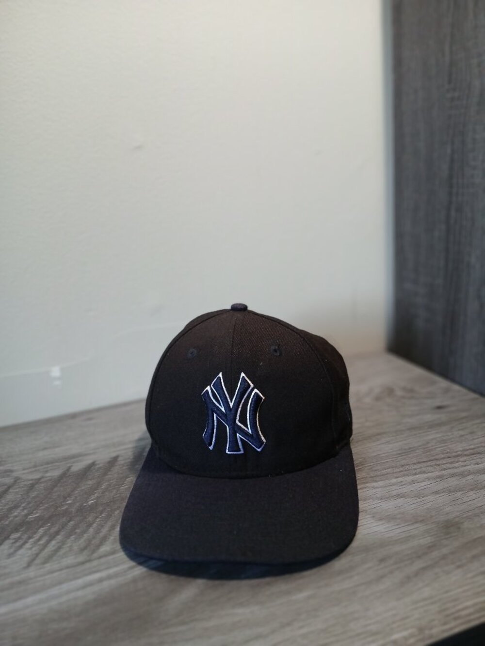 New York Yankees.  Genuine merchandise.  100 percent wool.  9 fifty snapback